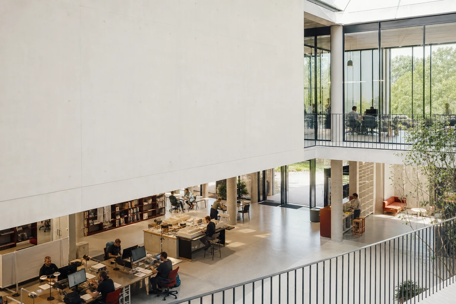 People working across an open, light-filled office